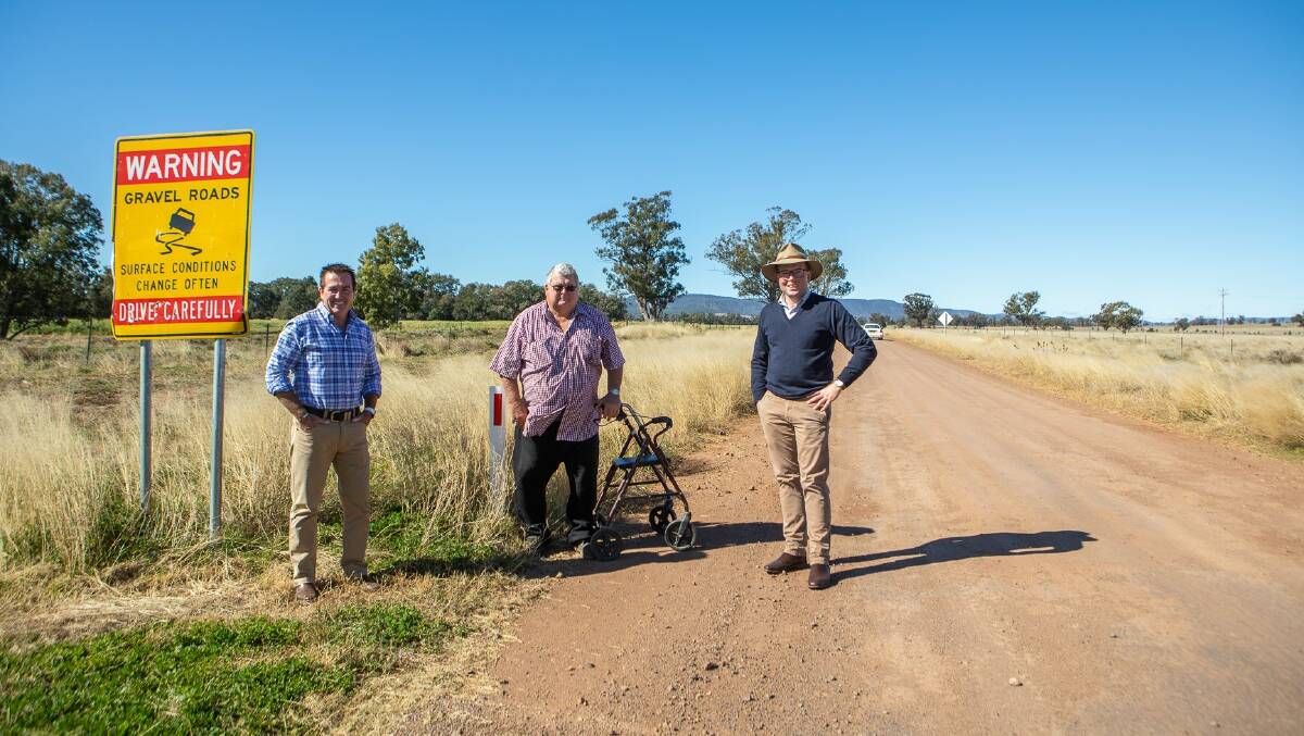 Minister for regional Roads and Transport Paul Toole, local grazier Allan Gillogly and Northern Tablelands MP Adam Marshall on the section of Terry Hie Hie Road which is about to be sealed thanks to state government funding.