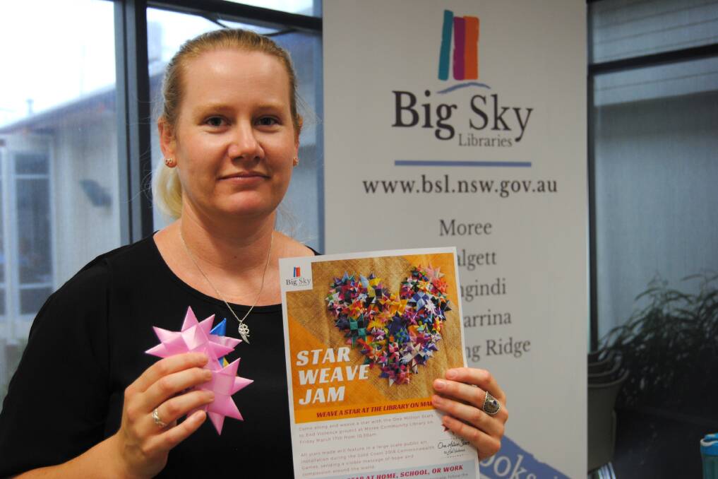 JOINING THE CAMPAIGN: Moree Library coordinator Samantha Geatches with some of the stars created for the One Million Stars to End Violence project.