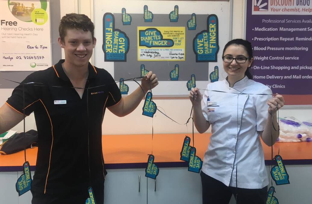 RAISING AWARENESS: Moree Discount Drug Store pharmacy assistant Oscar Davis and pharmacist Elsie Barnes encourage Moree people to come in store for a free diabetes risk assessment.