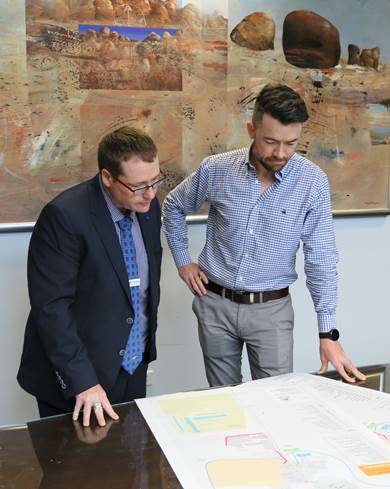 Mark Connolly and Daniel Boyce reviewing SAP draft plans. Photo: supplied