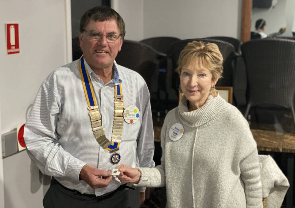 Outgoing president Linda Meppem (right) presented the presidents' badge to incoming president Gregg Humphries at the changeover earlier this month. Photo: contributed