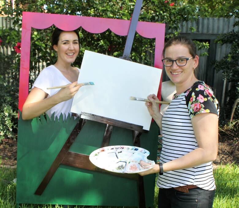 FUN: Moree Plains Gallery director Vivien Clyne and education officer Caitlyn Boland with the photobooth which will be set up as part of Saturday's open day.