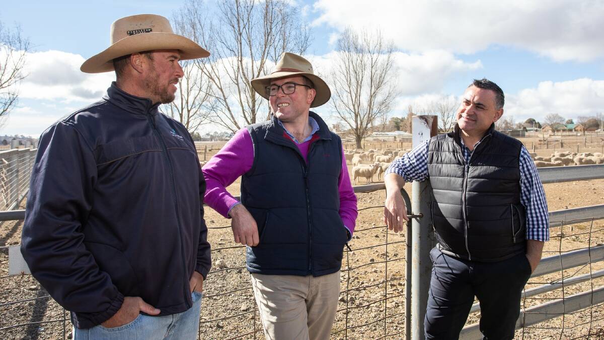 Glen Innes stock and station agent Shad Bailey, left, chatting with Northern Tablelands MP Adam Marshall and Deputy Premier John Barilaro recently.