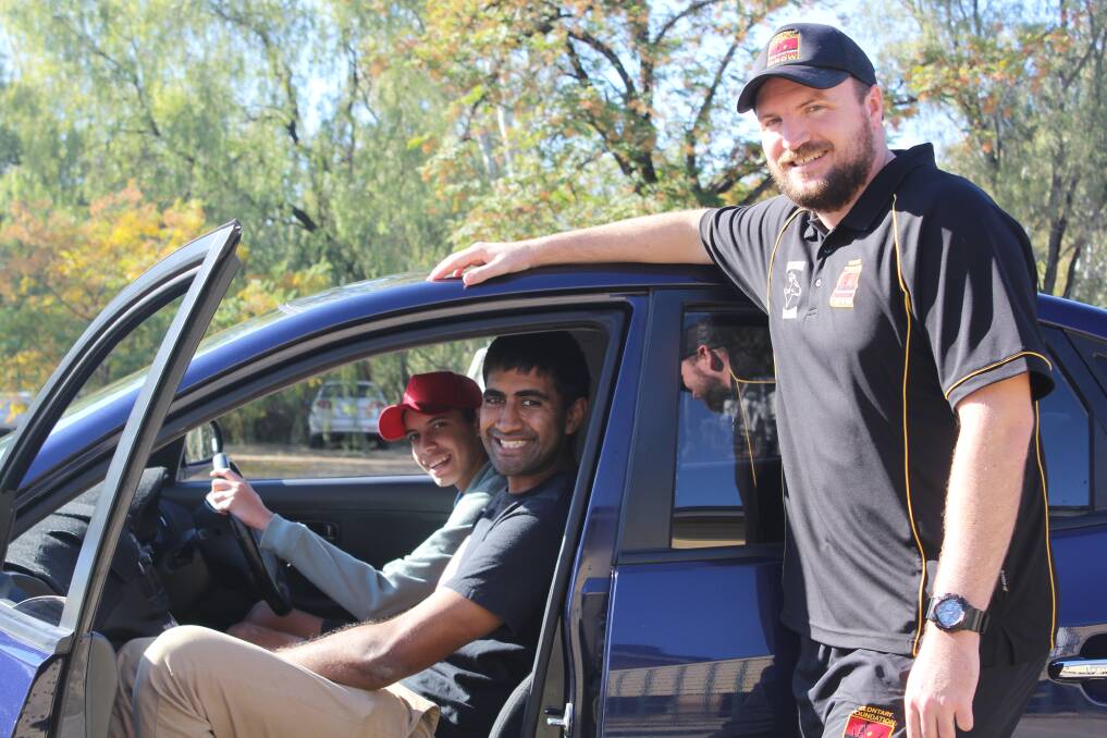 DRIVING UP HOURS: Moree Salvation Army program manager Jason Poutawa supervises year 11 student Branden Barker while he's behind the wheel of the newly-obtained car, watched on by Moree Clontarf Academy director Eric Faulkner. Photo: Elka Devney