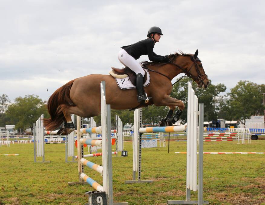 Emma Botfield riding her beloved horse Norton at Gunnedah Showjumping
Festival in June this year. 