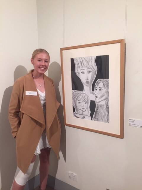 TALENTED: Olivia Mihill pictured with her artwork 'Toil and Trouble' at the opening of the 'Let's Hang It' exhibition.