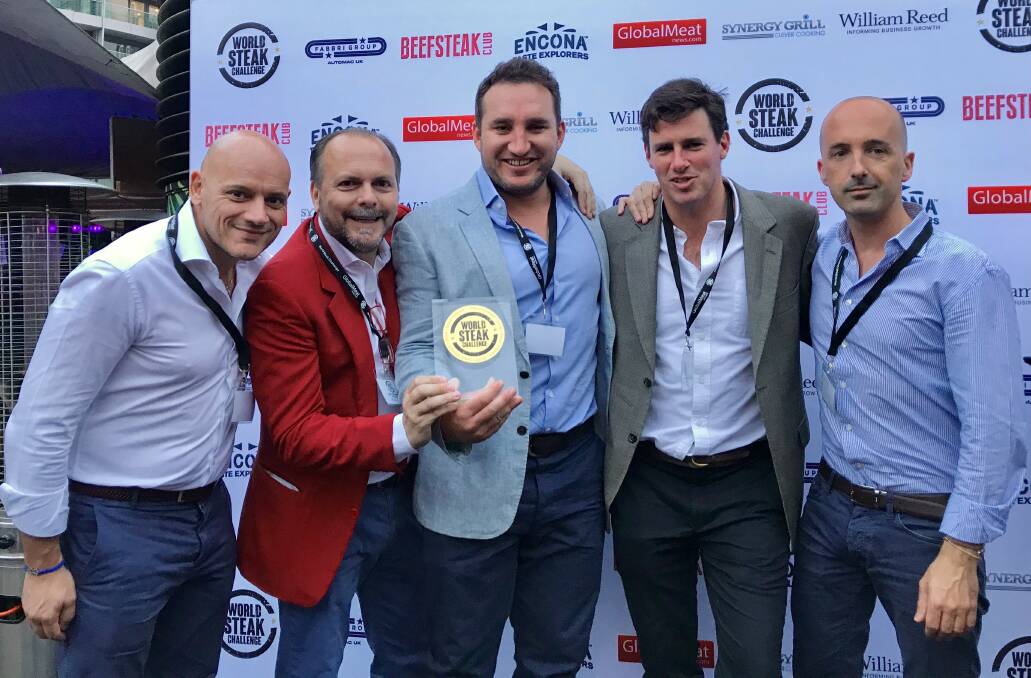 BIG WIN: Rosedale Ruby founders Sam McNiven (centre) and James Millner (second from right) show off their gold medal with some of their European clients.