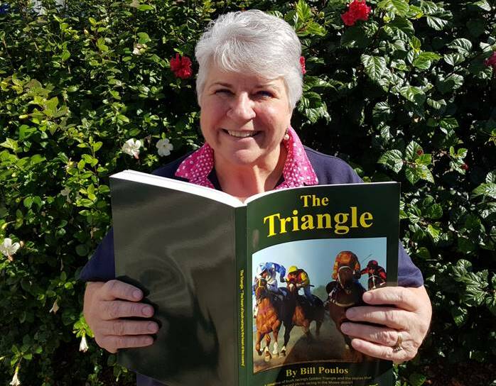Moree Mayor Councillor Katrina Humphries gets a sneak peak of 'The Triangle', published with the help of funding from Moree Plains Shire Council. Photo: MPSC