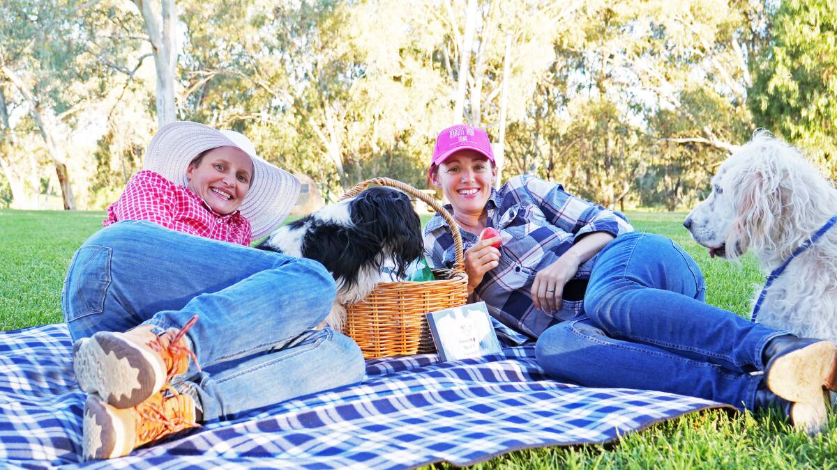 SET TO LAUNCH: Moree singer-songwriters Merri-May Gill and Fi Claus, pictured with adorable pooches Denver and Teddy, encourage everyone to bring their own picnic to Mary Brand Park and enjoy their debut album 'Sunday Heart Parade'.