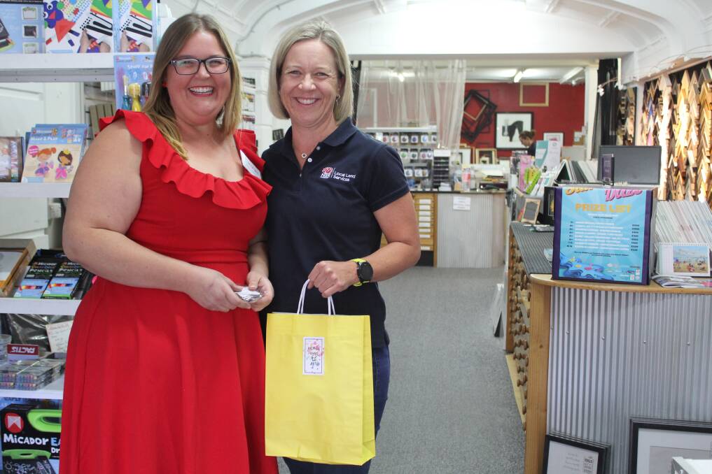 Moree Frame and Art's Carolyn Ferguson with shopper Sally Poole at last year's late night shopping evening.