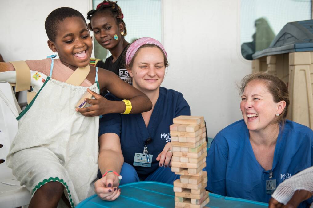 GIVING BACK: Sarah Bagshaw (right) loved making a difference to patients' lives on board the Africa Mercy, and particularly enjoyed her interactions with the children.