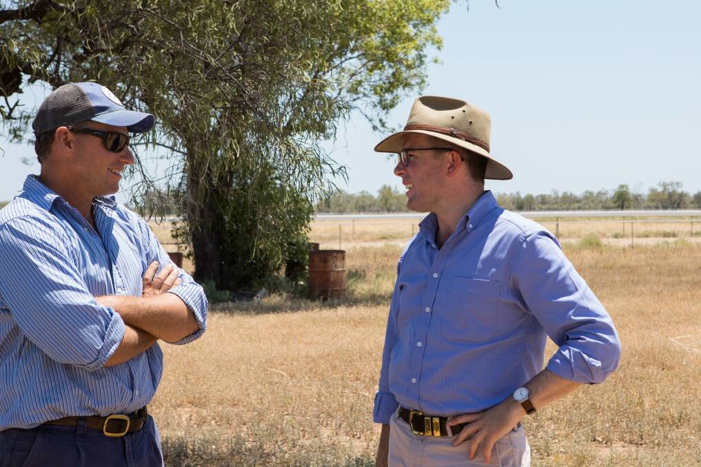 NSW Minister for Agriculture Minister Adam Marshall speaking to a farmer in western NSW about native vegetation laws. Photo: contributed