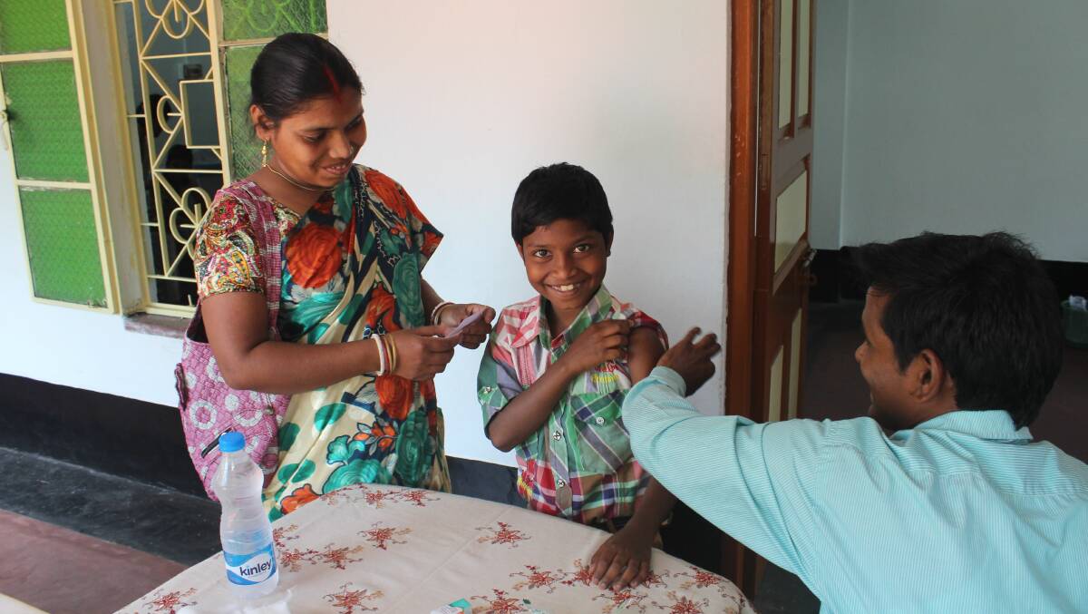 A child receives a Free2Be flu shot in India, thanks to Discount Drug Stores' 'Get a shot, give a chance' campaign.