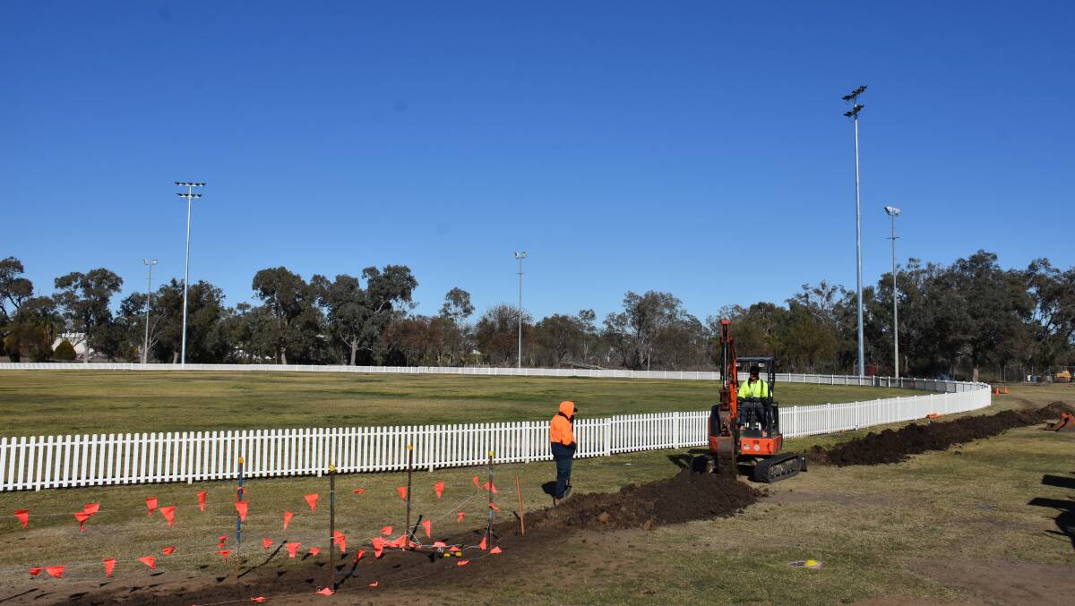 Council workers are currently undertaking trenching and wiring works to power the new LED lights, pictured in the background.