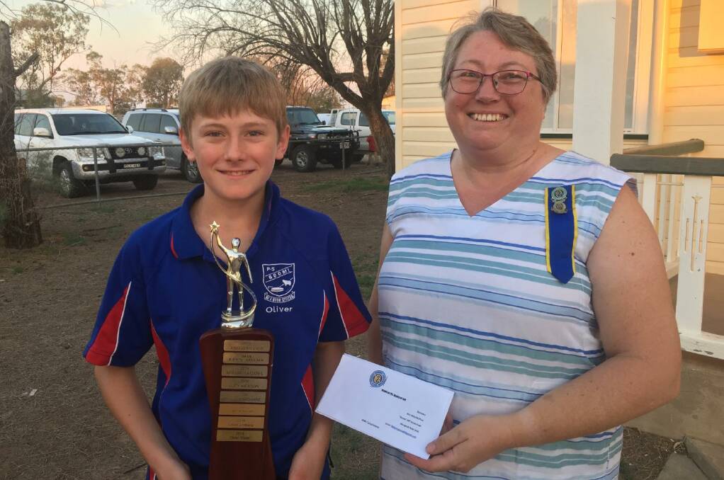 Weemelah CWA Branch president Ruth Moore (right) presented Boomi Public School year 6 student Oliver Wierer with the CWA Community Spirit Award. Photo: contributed