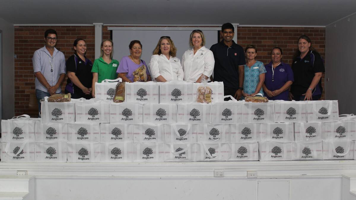CHRISTMAS ANGELS: Moree Family Support's Shane Smith, Byamee's Bianca Smith, Flourish's Nicole Falkiner, Ngala Women's Refuge's Marlene Howard, Anglicare's Claire Dunlop and Louise O'Neill, Moree Salvation Army's Jason Poutawa, Woolworths Moree's Kylie Heffernan, Moree Family Support's Kylie Smith and Byamee's Jo Williams with the hampers.