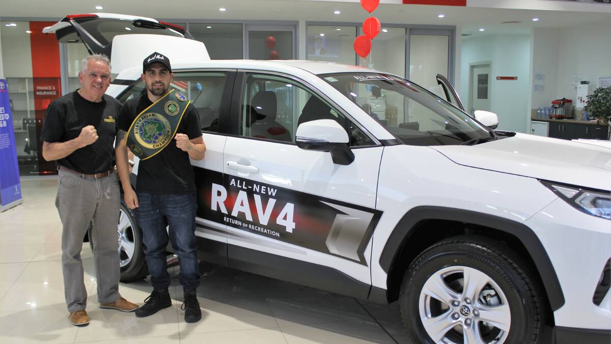 AMBASSADOR: Australian Champion Super Featherweight boxer TC Priestley (right) and coach Colin 'Chalky' Rice at Tait Toyota's launch of the new Toyota RAV4 last Friday.