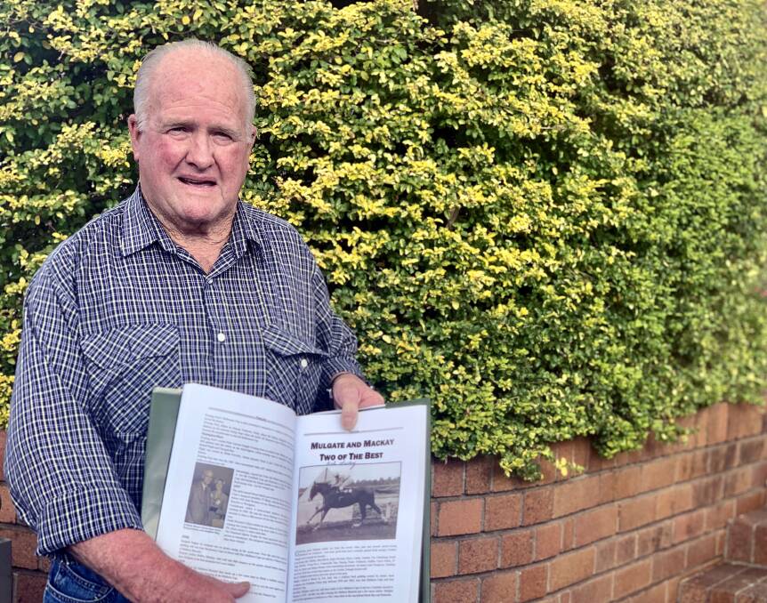 Bobby Mackay with a copy of 'The Triangle', which will be for sale at Talmoi picnics at Garah on June 22. Mackay will also be trackside, as a special guest of the club. Photo: Aneeka McNamara