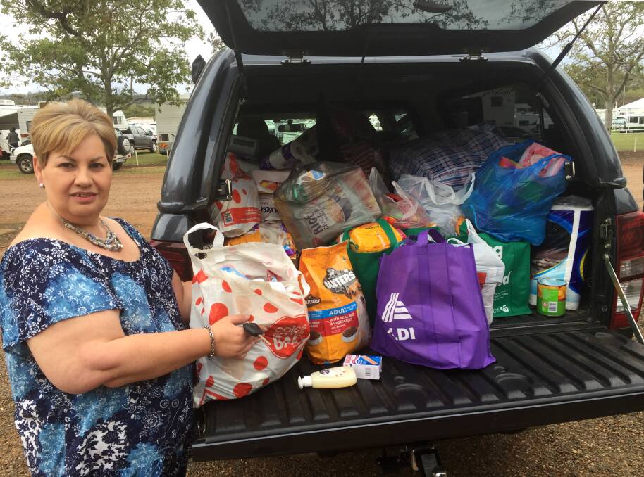 Doing it for our Farmers' Gunnedah coordinator Erica Meintjes with a packed boot on Friday. Photo: Sheridan Crawshaw