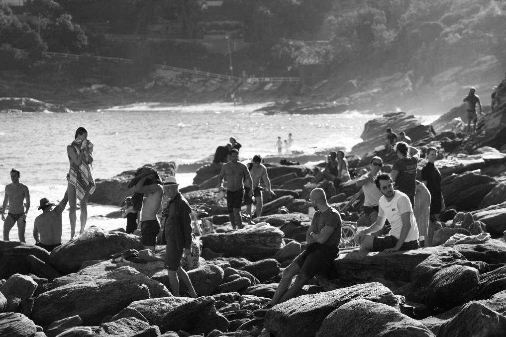 Sunbathers and swimmers on Sydney's Gordon Bay flaunting social isolation and distancing measures. They would be dispersed 30 minutes later by police. April 18, 2020. Photo: Dean Sewell/Oculi
