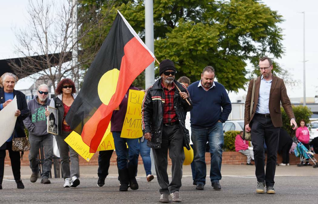 Justice march: Don Craigie leads family and friends of Mark Haines, and Greens MLC David Shoebridge (right) to the Tamworth Police station to demanding action on the cold case. Photo: Gareth Gardner