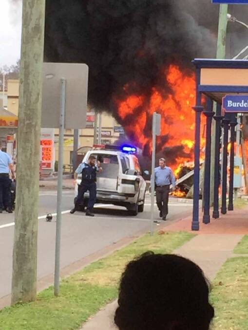 AFTERMATH: A glimpse of the destruction caused when a truck, suspected to have been stolen, crashed into vehicles and buildings on George St, Singleton, then caught fire. Photo: Ashley Dank