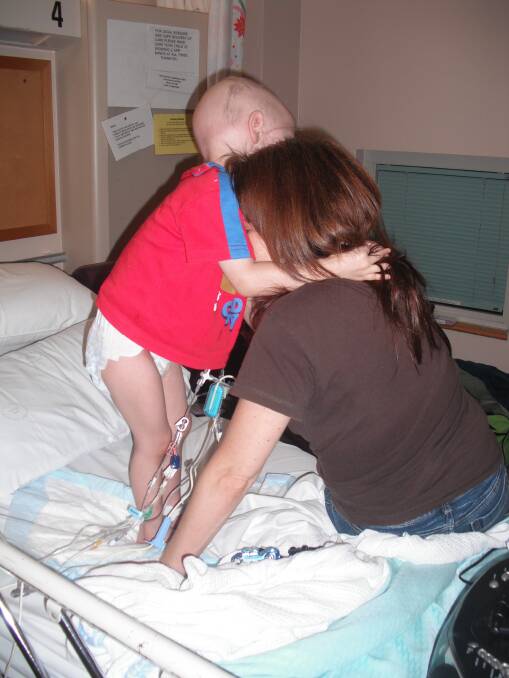 The family remembers Cameron was often in terrible pain - here, mum Anita offers the best comfort she can.