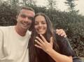 SHE SAID YES: Steele Harvey and Remy Spillane after their crossword engagement at King Edward Park on Saturday. Picture: supplied