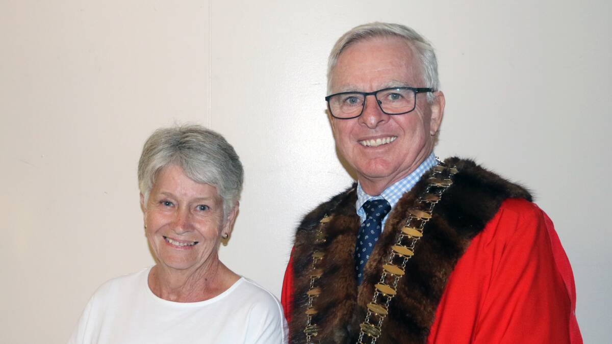 Moree Mayor Mark Johnson presents Lyn Moore with her award at a lunch at Moree and District Services Club on Wednesday, March 13. Ms Moore says she was surprised and honoured by the award. Photo supplied 