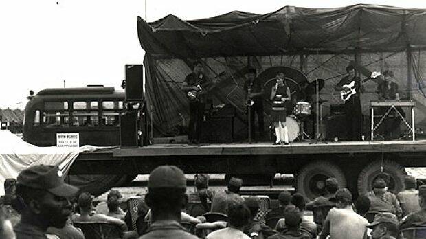 FLASHBACK: Little Pattie, then aged 17, performing in Vietnam. She had been entertaining Australian troops when the Battle of Long Tan broke out.