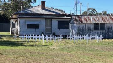 Mungindi RSL sub branch president Kevin McCosh says the white crosses have been placed as a symbol of Mungindi residents, past and present, who served in wars.