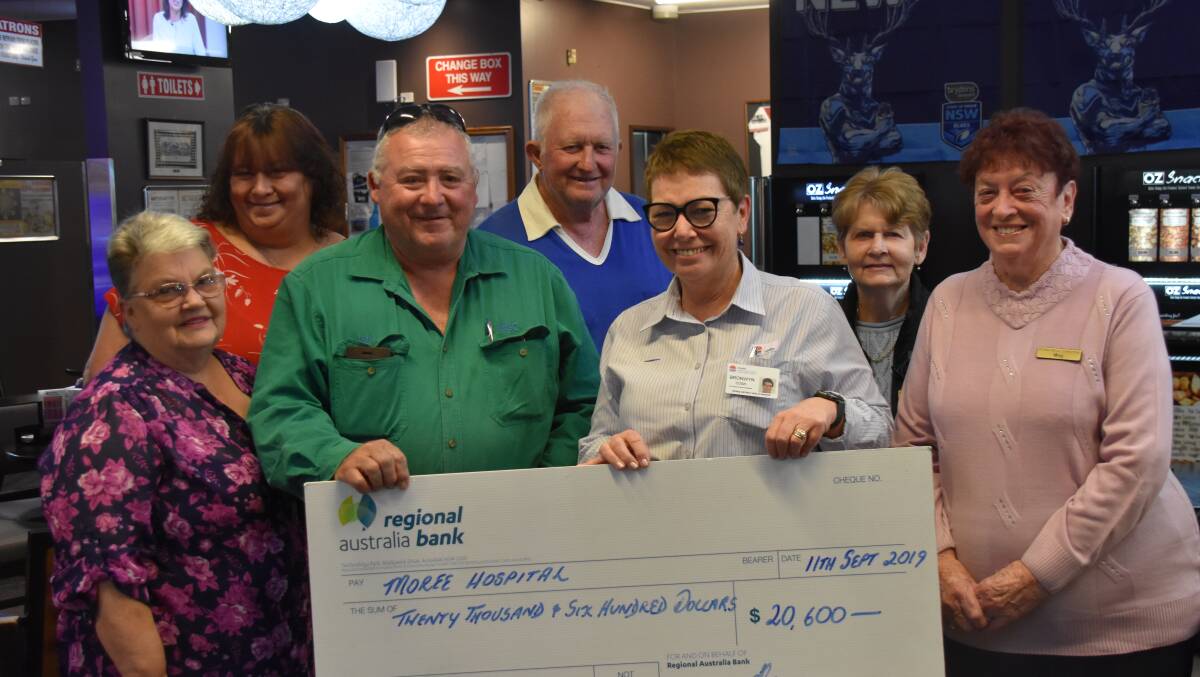 SEPTEMBER: Moree Hospital health service manager Bronwyn Cosh presents a cheque to Moree Hospital staff. The money is for an invasive monitoring machine.
