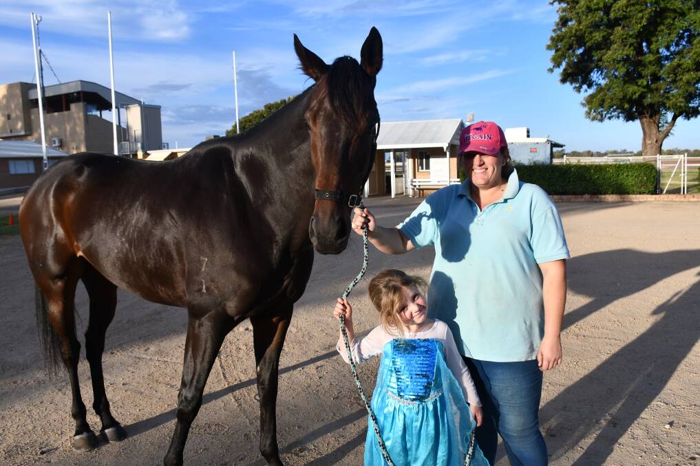 QUICK AS A FLASH: Alayne and stablehand Amee Williams stand next to the successful Track Flash.