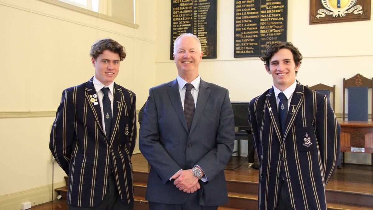 Head of School Alan Jones with Louis Cannington (left) and Oliver Cook following their induction at a ceremony on October 15.