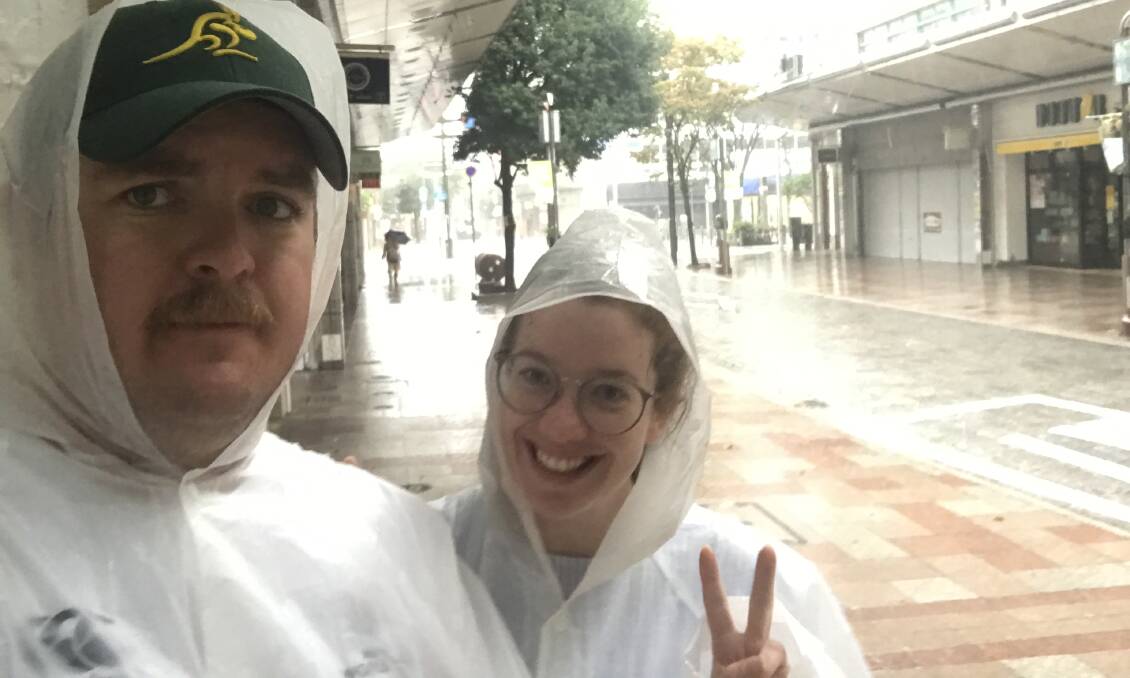 Calum Drysdale and Sophie Harris brave the wet weather on the deserted streets of Shizuoka on Saturday morning before Typhoon Hagibis hit Japan.