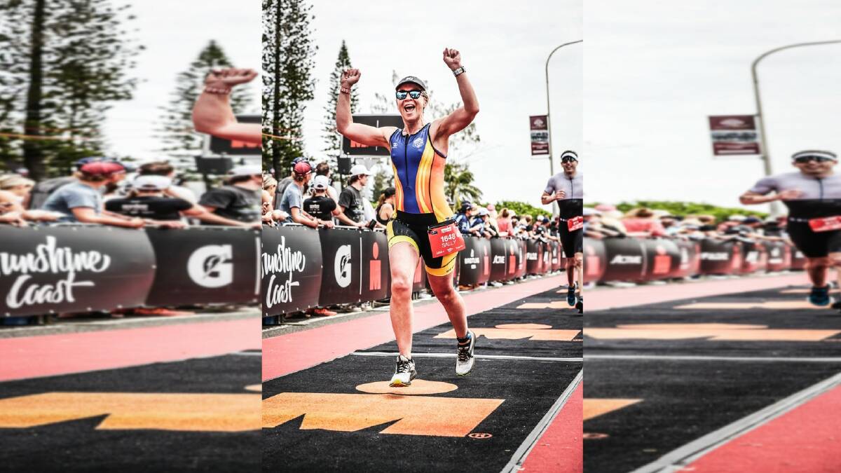 Moree triathlete Sally Poole celebrates after finishing third at Port Macquarie.