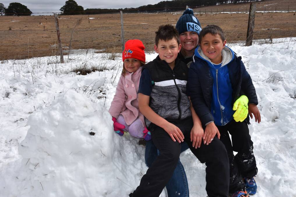 FUN IN THE SNOW: Sallisah, Leeroi, Codie and Lewis Stokes, from Gravesend at Guyra on Monday. Picture: Nicholas Fuller