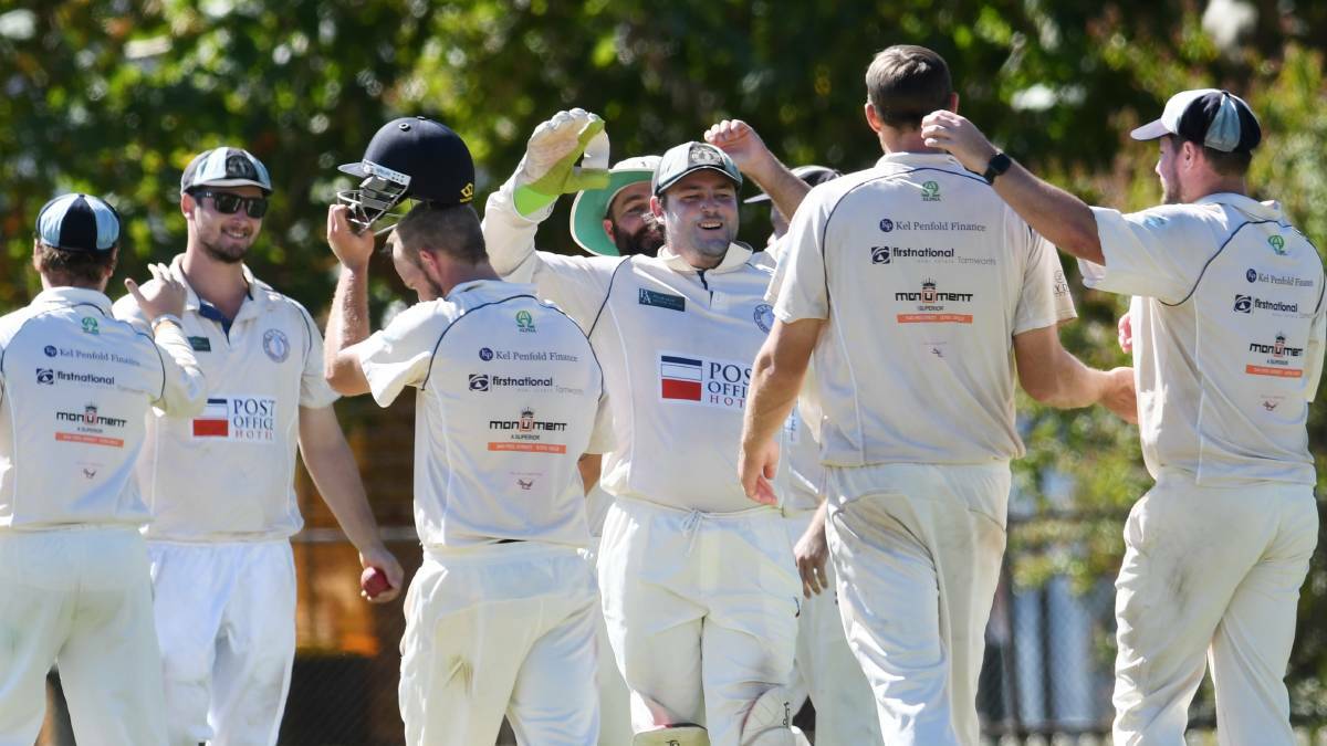 THE END IS NIGH: Souths celebrate another Old Boys wicket. Photo: Gareth Gardner 