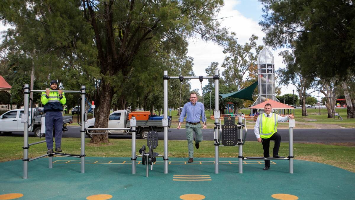  WORKING UP A SWEAT: Moree Plains Shire Council Open Space Crew member Wyatt Roberts, left, Northern Tablelands MP Adam Marshall and General Manager Lester Rogers try out some of the new exercise equipment installed as part of the $502,554 Moree Mehi River Corridor project. 