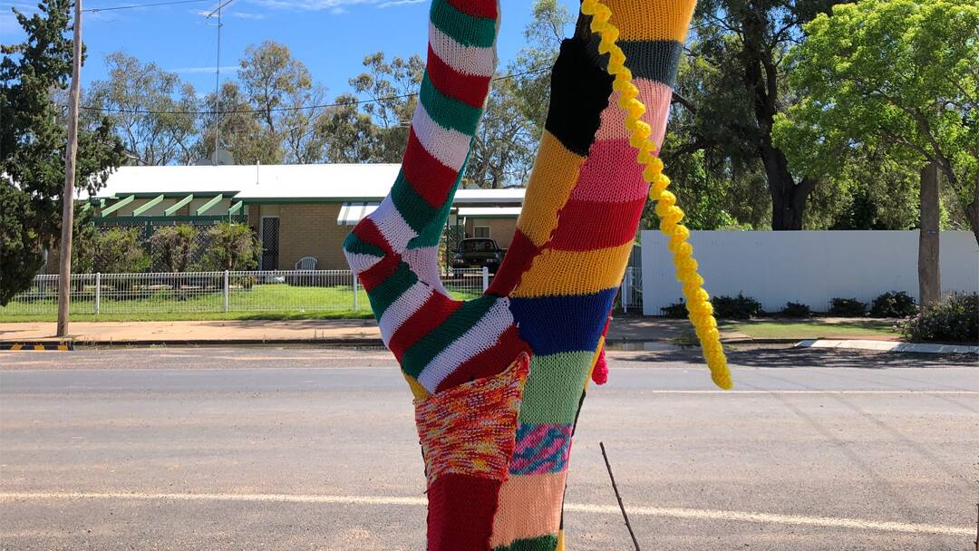 The Library Craft Group and anonymous community members have donated and installed the yarn art at Mungindi