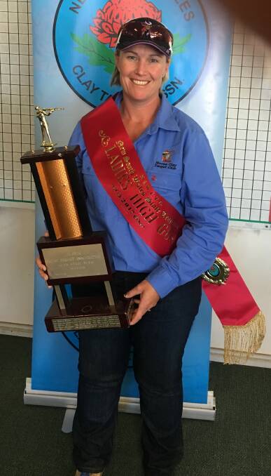 Dimity Boydell holding the trophy she won at the qualifying shooting competition in Wagga Wagga last October.