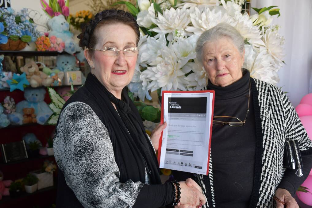 Alma Lees Florist owner Suzanna Lysaught holding the accepted nomination paper with Aunty Noeline Briggs-Smith.
