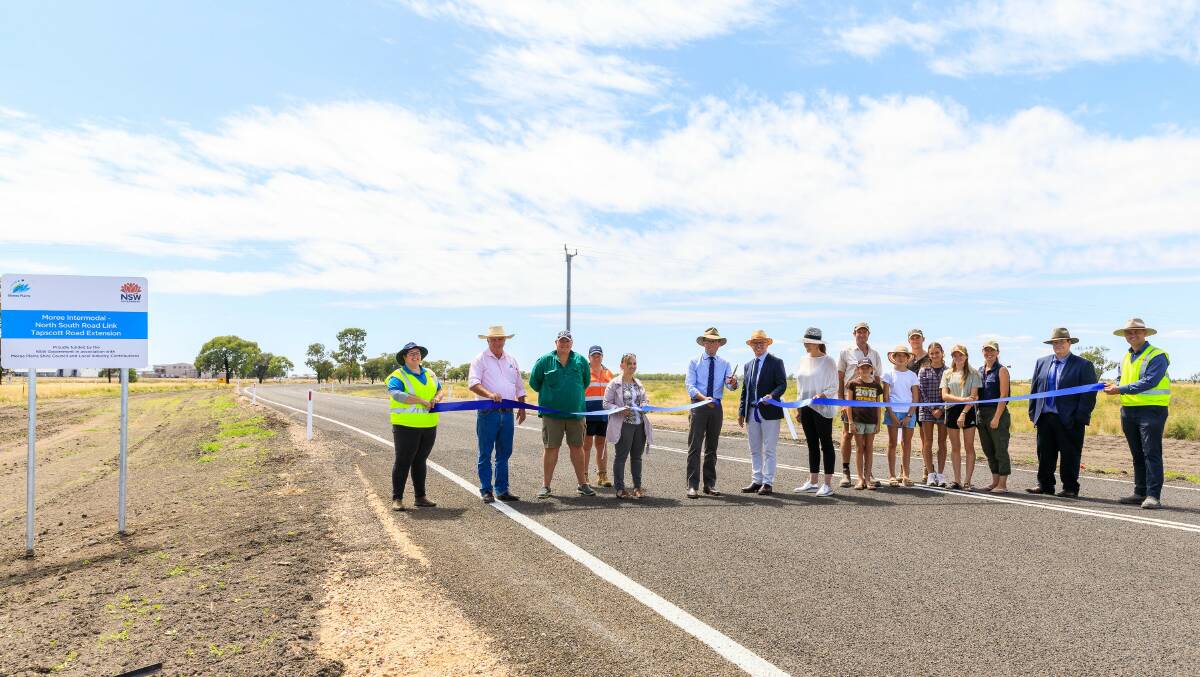 VITAL LINK: Moree Plains Shire Council road safety officer Renee McMillan, Councillor Mike Montgomery, Louis Dreyfus Company Manager Kevin Chaplin and Kara Smith, Councillor Kelly James, Northern Tablelands MP Adam Marshall, Mayor Mark Johnson, Deputy Mayor Susannah Pearce, landholders Andrew and Petra Mitchell, Josephine, Zach, Cedar, Eden and Mandy, Community and Economic Development Manager Mark Connolly and Engineer Leonard Maharaj cutting the ribbon. Photo: Supplied.