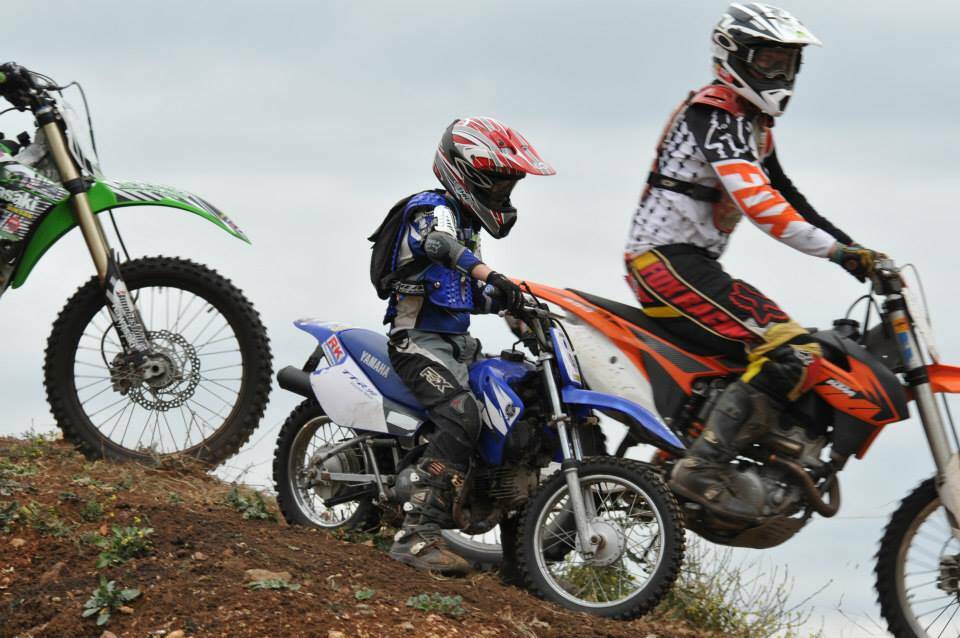 A junior and senior rider take on the gravel pit.