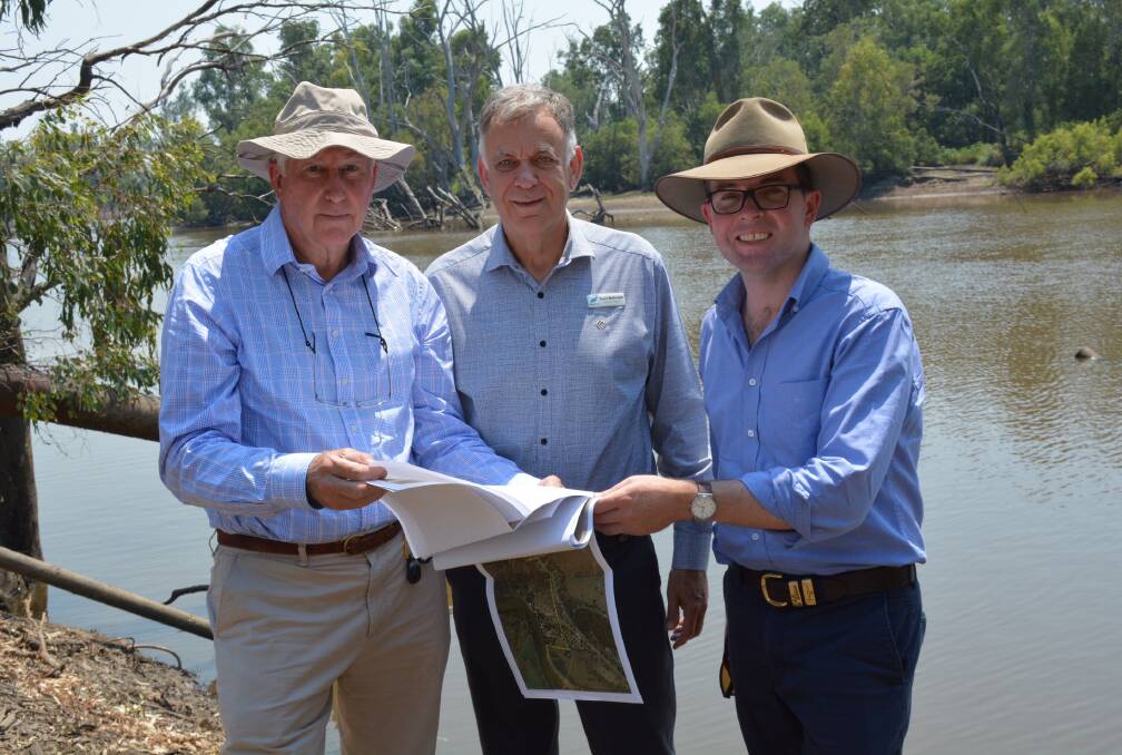 Moree Plains Shire Council Project Manager Graham Macpherson, Water and Waste Manager David Wolfenden and Northern Tablelands MP Adam Marshall inspect plans at the site of the upcoming new Boggabilla-Toomelah water pipeline, on the Macintyre River at Boggabilla.
 