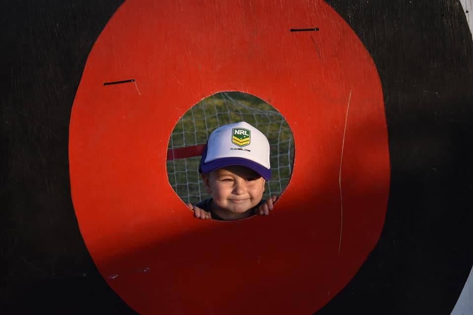 Archa Whalan gives a cheeky grin from the throwing target.