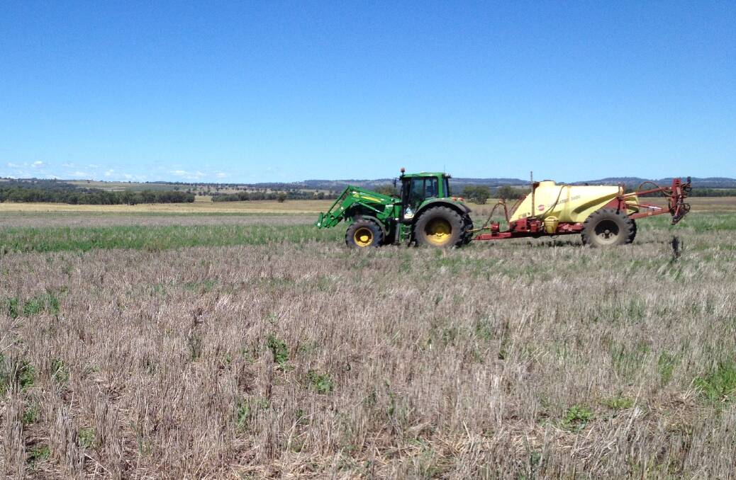 Spraying weeds in your summer fallow to maintain soil moisture.