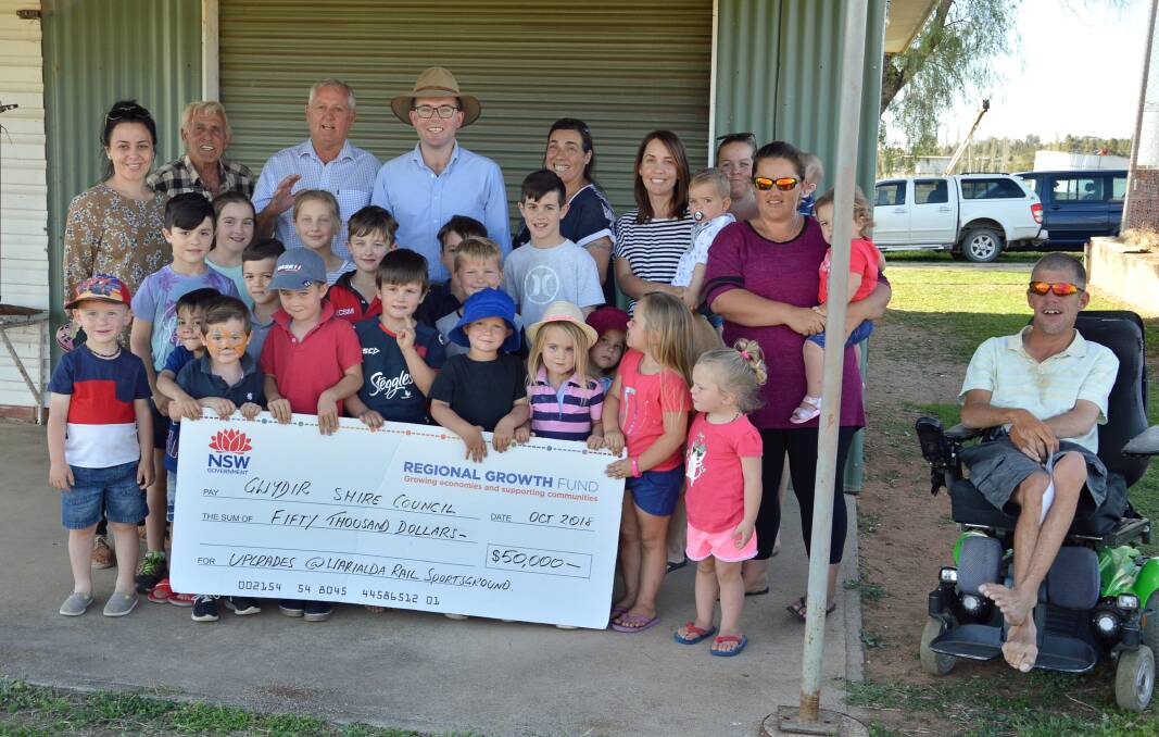 Warialda Rail community members and a few of the local youngsters using the popular grounds celebrate a funding boost. (Back row) Erin Hall, John Riley, Gwydir Shire Mayor John Coulton, Northern Tablelands MP Adam Marshall, Suzanne Webster, Jackie Smith, Emma Munn, Karen Rose and Justin Churchland.