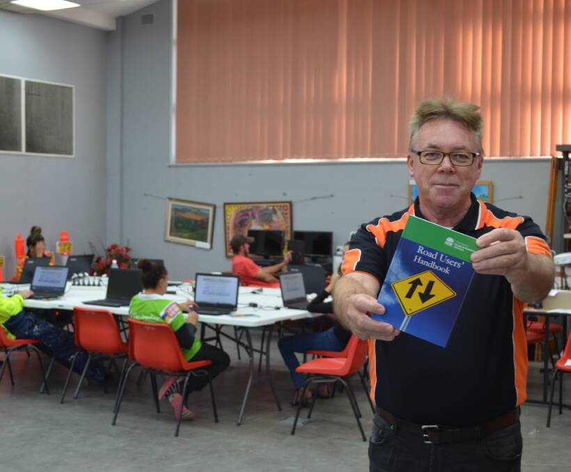 Safety first: Driving instructor and trainer George Bullivant teaches participants more than 600 road rules out of the Road Users Handbook.
