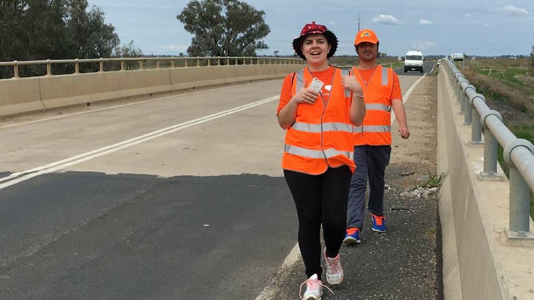 Spot the orange: Jess Scully and Glen Crump hiking for homeless last year.